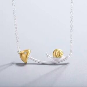 Gold and Silver Snail Pendant Necklace